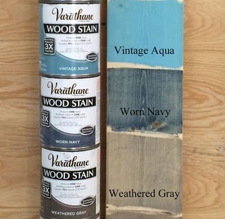 a stack of paint and woodworking supplies for sale