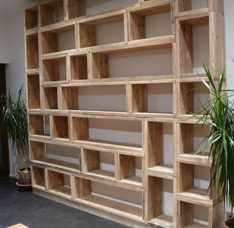 a wooden shelf with a plant in it