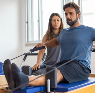 a man and woman doing pilateste on a pilateste