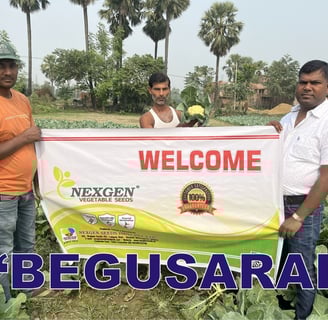 a group of men standing in a field with a banner that says welcome to the
