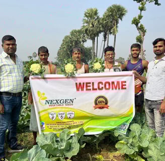 a group of men standing in a field with a welcome sign