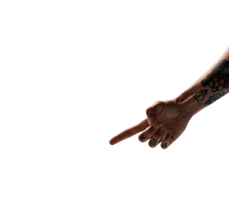 a tattoed arm pointing down