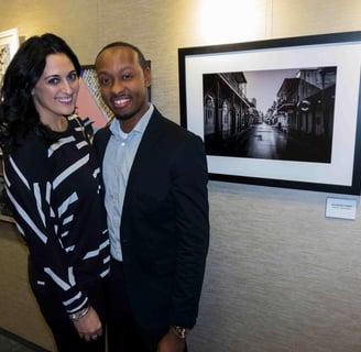 photographer gary washington standing next to bourboun st artwork