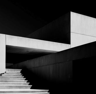 Minimalist concrete building with stairway.