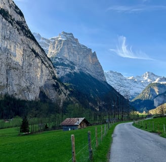 View looking up the Lauterbrunnen Valley in Switzerland with limestone cliffs towering above