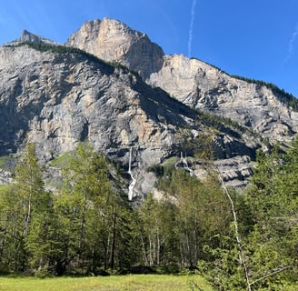 Waterfalls appearing out of the walls of the Gasterntal