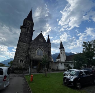 Kirche St. Joseph with the Interlaken Stadtkirche behind it.