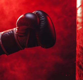 Gant de boxe en cuir noir sur fond rouge intense avec effet dramatique et éclairage atmosphérique