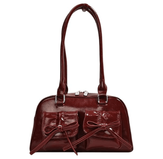 a red handbag with bowknots and bows