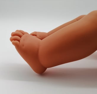 feet of a Miniland doll