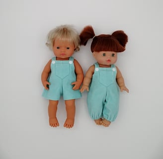 Miniland doll and Minikane doll dressed in handmade dungarees