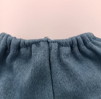 Flaw in elastic waistband of trousers
