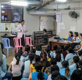 Dr Zaw giving a speech to a group of audience