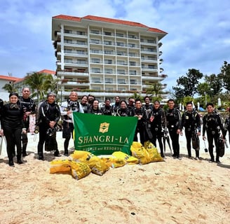 Group photo of the dive team in the beach of Shangrila that helped the clean up