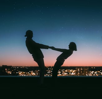a man and woman dancing in the night