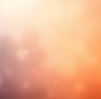 a couple kissing in the foggy sky
