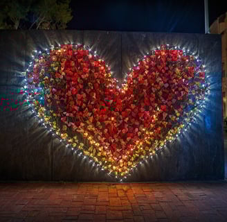 a heart shaped sign with lights on it
