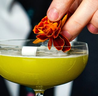 Bartending Garnishing a cocktail with a Marigold Flower