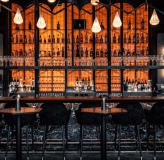Lucky Cat BishopsGate,Luxury cocktail bar with ambient lighting, premium spirits, and elegant decor.