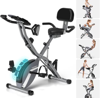 a woman is sitting on a stationary bike