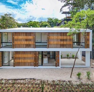 a modern house with a wooden deck and a pool
