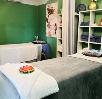 Certified Thai massage therapist performing traditional massage on a client in Ashburton spa