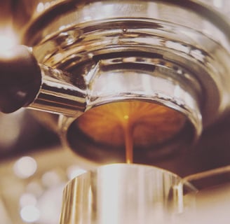 a coffee maker is making a cup of coffee
