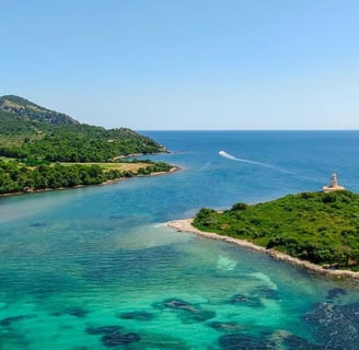 Panoramic shot of Alcanada Island, a key stop on Balea Charters boat tours in Mallorca