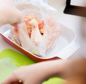 putting chicken in a ziplock pouch