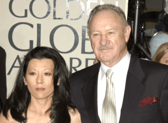 a man and woman standing next to each other