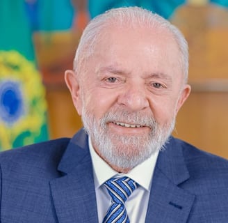 a man in a suit and tie with a blue tie lula