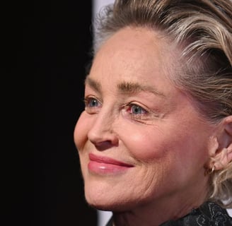 a woman with blonde hair and a black jacketsharon stone