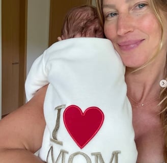 a woman holding a baby in her arms