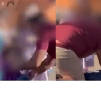 a man in a red shirt is holding a suitcase