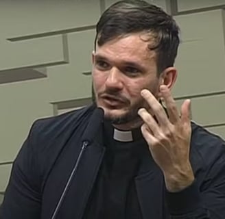 a priest in a black jacket and a priest in a black shirt