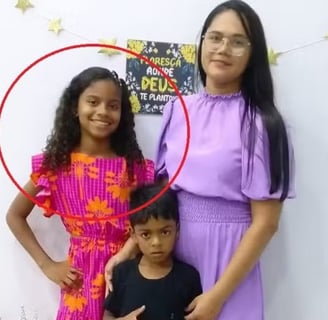 a woman standing next to a young child