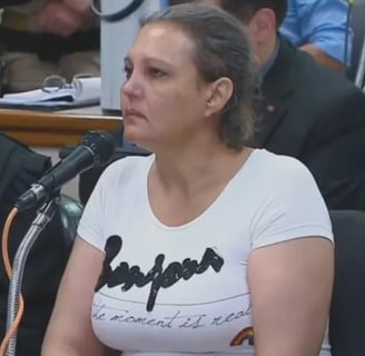 a woman in a white shirt and a man in a suit and tie