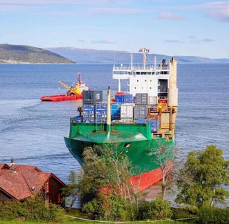 a large ship is docked in a harbor