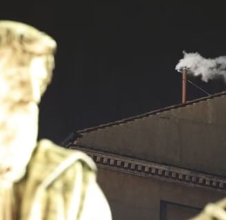 a statue of a man with a pipe smoking a pipe