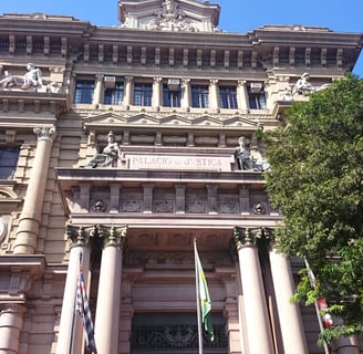 a large building with a clock tower in the middle of it