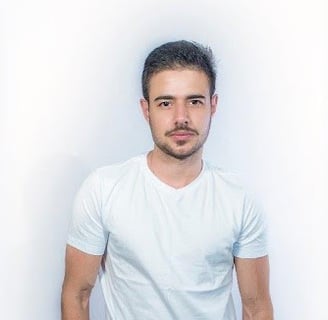 a man in a white shirt and jeans