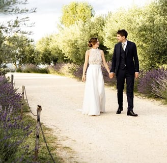 Bride and groom walking in lavender field — editorial fine art wedding photographer South of France