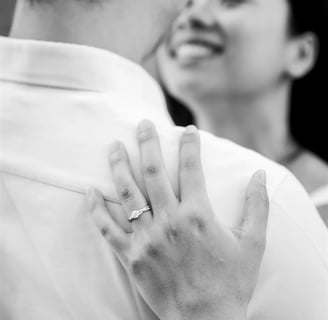 Provence engagement photographer – black and white of engagement ring as couple embraces