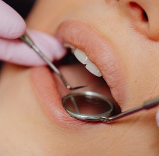 dentist examining a woman's mouth