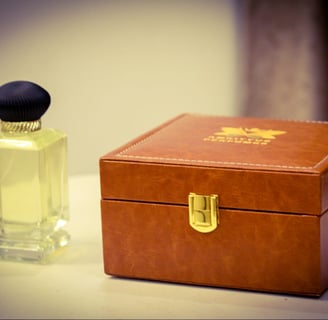 a small wooden box with a bottle of perfume