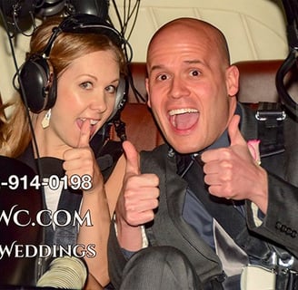 wedding couple inside a helicopter thumbs up