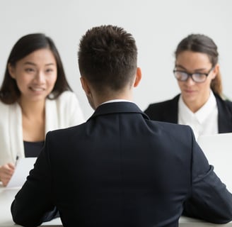 Male candidate interviewed by diverse HR team