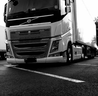 a truck with a large truck behind it