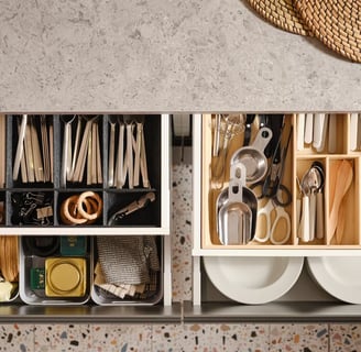 a kitchen with a shelf with utensils and utensils