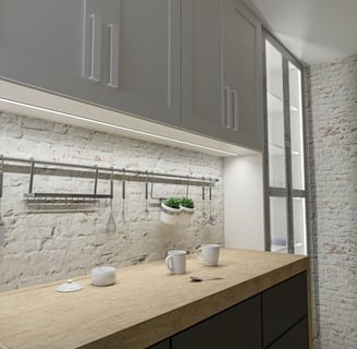 a kitchen counter top with a potted plant in the middle